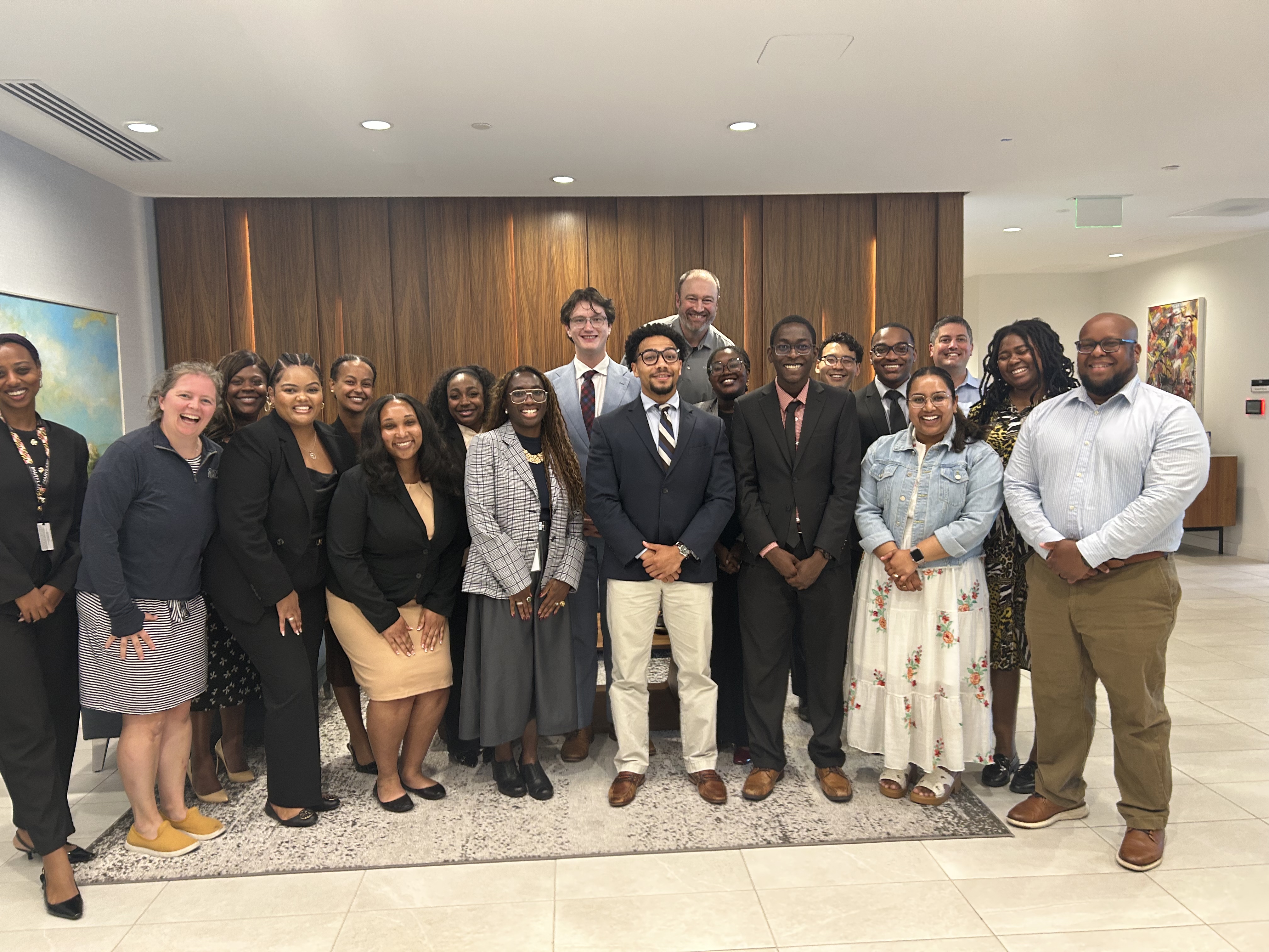 Students from the Attorney General Thurgood Marshall Clerkship Program and attorneys photographed in reception areaa