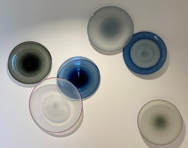 Glass blown plates commissioned by the firm