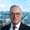 Barry Gogel in formal headshot wearing a black jacket, red tie and white shirt